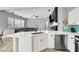Bright kitchen with white cabinets, stainless steel appliances, and modern countertops at 10385 Kern Ridge St, Las Vegas, NV 89178