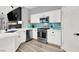 Modern kitchen featuring white cabinetry, subway tile backsplash, and stainless steel appliances at 10385 Kern Ridge St, Las Vegas, NV 89178