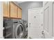 Laundry room with washer, dryer, and storage cabinets at 10385 Kern Ridge St, Las Vegas, NV 89178