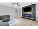 Open concept living room with fireplace, and modern flooring at 10385 Kern Ridge St, Las Vegas, NV 89178