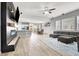 Spacious open-concept living room with modern fireplace, kitchen view, and comfortable seating at 10385 Kern Ridge St, Las Vegas, NV 89178
