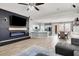 Open-concept living space with modern fireplace, sleek floors, and ample natural light flowing into the adjacent dining area at 10385 Kern Ridge St, Las Vegas, NV 89178