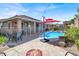 Inviting backyard with a pool and fire pit, perfect for outdoor entertaining and relaxation at 10385 Kern Ridge St, Las Vegas, NV 89178