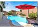 Beautiful backyard with a sparkling pool and lush landscaping, creating a private retreat at 10385 Kern Ridge St, Las Vegas, NV 89178