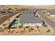 An aerial view of a modern home with a pool and well-kept desert landscaping in a suburban setting at 1357 Manassas Rdg Rdg, Mesquite, NV 89027