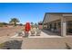 Lush backyard boasts a refreshing pool, comfortable lounge chairs, and a covered patio for relaxation at 1357 Manassas Rdg Rdg, Mesquite, NV 89027
