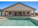 Backyard oasis with a sparkling pool, lounge area, and covered patio for entertaining at 1357 Manassas Rdg Rdg, Mesquite, NV 89027