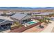 Inviting backyard with a sparkling private pool, lounge chairs, patio seating and beautiful landscaping at 1357 Manassas Rdg Rdg, Mesquite, NV 89027
