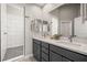 Modern bathroom features double sinks, sleek cabinetry, and a luxurious walk-in shower at 1357 Manassas Rdg Rdg, Mesquite, NV 89027