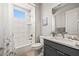 Modern bathroom with a sleek vanity, white tile shower, and contemporary finishes at 1357 Manassas Rdg Rdg, Mesquite, NV 89027