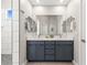 Elegant bathroom with dual sinks, large mirror, and walk-in shower with modern tile at 1357 Manassas Rdg Rdg, Mesquite, NV 89027