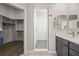 Bathroom featuring a walk-in shower, modern vanity with sink, and walk in closet at 1357 Manassas Rdg Rdg, Mesquite, NV 89027