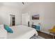 Comfortable bedroom featuring ensuite bathroom and ample lighting at 1357 Manassas Rdg Rdg, Mesquite, NV 89027