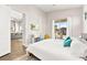 Bedroom with a view to the living room and sliding glass doors to the outdoor living space at 1357 Manassas Rdg Rdg, Mesquite, NV 89027