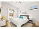 Modern bedroom with a large bed, neutral decor, and sliding door access to the backyard at 1357 Manassas Rdg Rdg, Mesquite, NV 89027