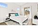 Serene bedroom featuring modern decor, a plush rug, outdoor views, and natural light at 1357 Manassas Rdg Rdg, Mesquite, NV 89027