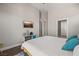 Bright bedroom featuring a TV, stylish decor, and ensuite bathroom for modern living at 1357 Manassas Rdg Rdg, Mesquite, NV 89027
