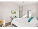 Well-lit bedroom with modern furnishings, backyard access, and a bright, airy ambiance at 1357 Manassas Rdg Rdg, Mesquite, NV 89027