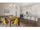 Open concept dining area connected to a modern kitchen with a large island at 1357 Manassas Rdg Rdg, Mesquite, NV 89027