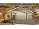 Inviting single-story home featuring a two-car garage and well-maintained desert landscaping at 1357 Manassas Rdg Rdg, Mesquite, NV 89027