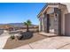 Front entrance with stylish pillars, desert landscaping and a view of the neighborhood at 1357 Manassas Rdg Rdg, Mesquite, NV 89027