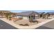 Landscaped front yard with desert xeriscaping, charming front door, and gated area at 1357 Manassas Rdg Rdg, Mesquite, NV 89027