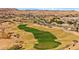 Scenic aerial view of a well-maintained golf course in a desert setting with mountain views at 1357 Manassas Rdg Rdg, Mesquite, NV 89027