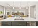 Bright kitchen featuring a center island with seating and stainless steel appliances overlooking the backyard pool at 1357 Manassas Rdg Rdg, Mesquite, NV 89027