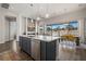 Spacious kitchen with an island that opens to dining area and living room with fireplace at 1357 Manassas Rdg Rdg, Mesquite, NV 89027