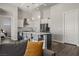 Modern kitchen features a large island with seating, stainless steel appliances, and pendant lighting at 1357 Manassas Rdg Rdg, Mesquite, NV 89027