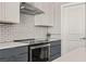 Close up of modern kitchen showcasing stainless steel oven, hood and white subway tile at 1357 Manassas Rdg Rdg, Mesquite, NV 89027