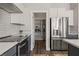 Modern kitchen featuring stainless steel appliances, subway tile backsplash, and pantry at 1357 Manassas Rdg Rdg, Mesquite, NV 89027