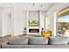 Bright living area with a modern fireplace, neutral tones, and access to the backyard and outdoor seating at 1357 Manassas Rdg Rdg, Mesquite, NV 89027