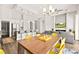 Open-concept living and dining area with a fireplace, backyard pool views, and modern decor at 1357 Manassas Rdg Rdg, Mesquite, NV 89027
