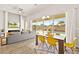 Bright living room with dining area featuring modern furnishings, fireplace, and pool view at 1357 Manassas Rdg Rdg, Mesquite, NV 89027