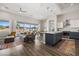 Open-concept living room and kitchen with island seating and access to outdoor pool at 1357 Manassas Rdg Rdg, Mesquite, NV 89027