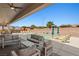 Inviting outdoor patio with a sparkling pool, lounge area, and covered seating perfect for outdoor living at 1357 Manassas Rdg Rdg, Mesquite, NV 89027
