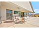 Expansive outdoor patio with a covered area featuring a ceiling fan and outdoor seating at 1357 Manassas Rdg Rdg, Mesquite, NV 89027