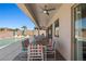 Covered patio featuring a dining area with colorful chairs and views of the sparkling pool at 1357 Manassas Rdg Rdg, Mesquite, NV 89027
