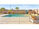 Backyard pool with poolside seating and lounge chairs offers a private space to relax at 1357 Manassas Rdg Rdg, Mesquite, NV 89027