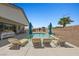 Relaxing backyard pool with lounge chairs, umbrellas and gorgeous mountain views at 1357 Manassas Rdg Rdg, Mesquite, NV 89027