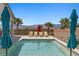 Sparkling backyard pool is surrounded by desert landscaping and inviting lounge chairs at 1357 Manassas Rdg Rdg, Mesquite, NV 89027