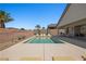 Private pool with lounge chairs, covered patio, and desert landscaping create an outdoor haven at 1357 Manassas Rdg Rdg, Mesquite, NV 89027