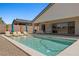 Backyard pool is paired with a covered patio and lounge chairs for the ultimate retreat at 1357 Manassas Rdg Rdg, Mesquite, NV 89027