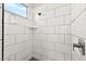 Clean and contemporary walk-in shower featuring modern tile, a rainfall showerhead, and a sleek design at 1357 Manassas Rdg Rdg, Mesquite, NV 89027