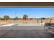 Backyard features a sparkling swimming pool, lounge chairs, and privacy wall perfect for relaxation and entertaining at 1357 Manassas Rdg Rdg, Mesquite, NV 89027