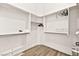Walk-in closet featuring wood floors and custom shelving for optimal storage at 1357 Manassas Rdg Rdg, Mesquite, NV 89027