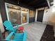 Patio with two turquoise chairs, red table and sliding glass door to interior at 1370 Vegas Valley Dr # 47, Las Vegas, NV 89169