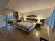 Spacious bedroom with mirrored closet, queen bed, wood flooring and decor at 1370 Vegas Valley Dr # 47, Las Vegas, NV 89169