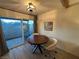 Cozy dining nook with stylish lighting, seating, and access to an outdoor patio at 1370 Vegas Valley Dr # 47, Las Vegas, NV 89169
